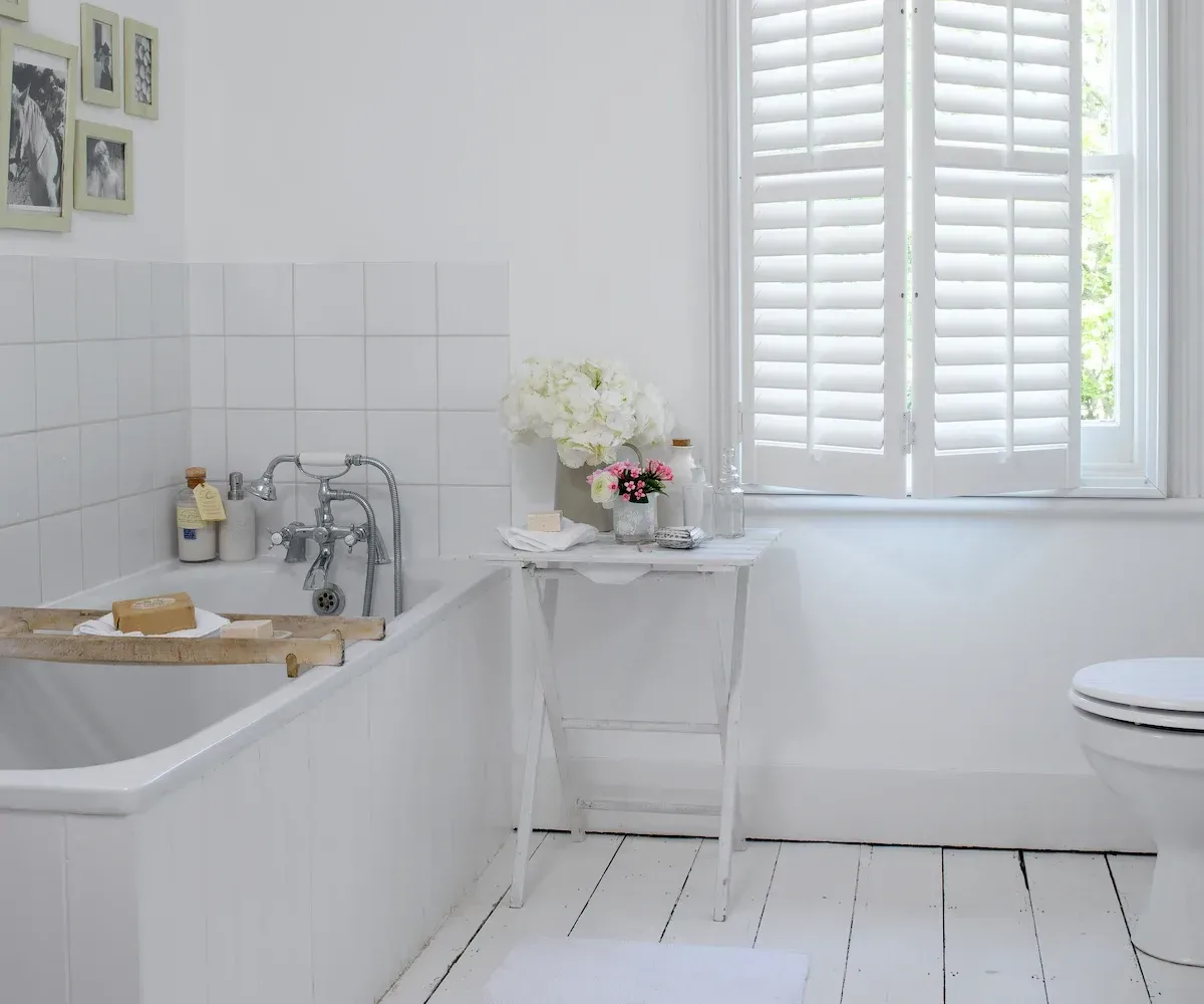Bright bathroom with shutters providing privacy